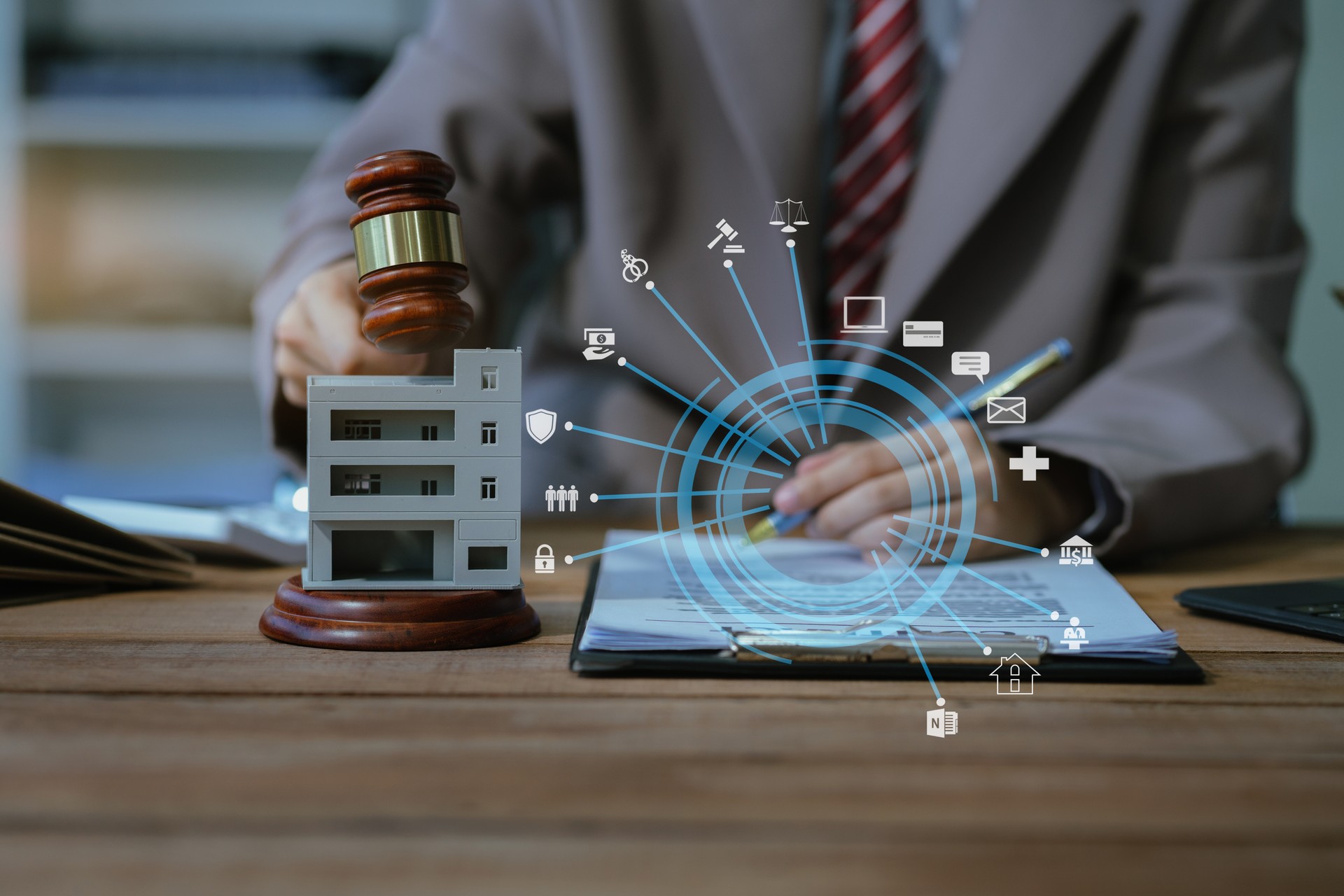 Justice and law concept. Real Estate Law in a courtroom the gavel, working with digital tablet computer on wood table in sun light.